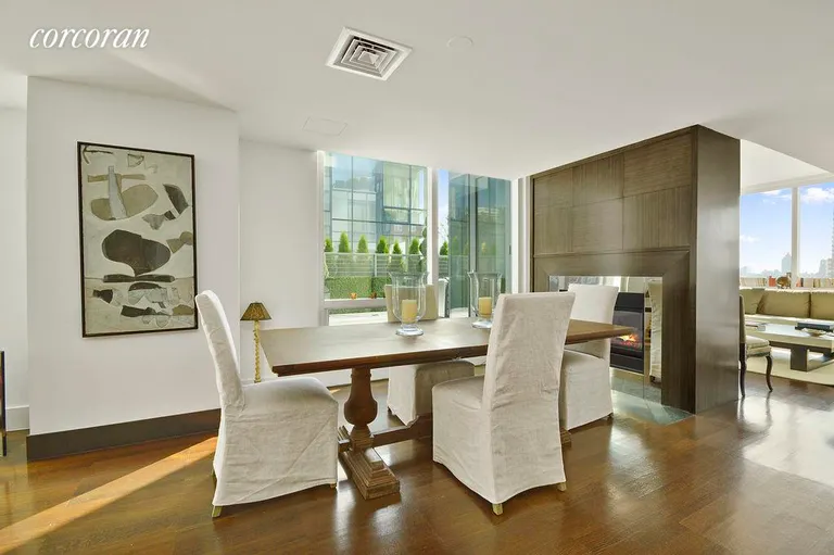 New York City Real Estate | View 151 East 85th Street, PHD | Dining Room and Fireplace | View 2