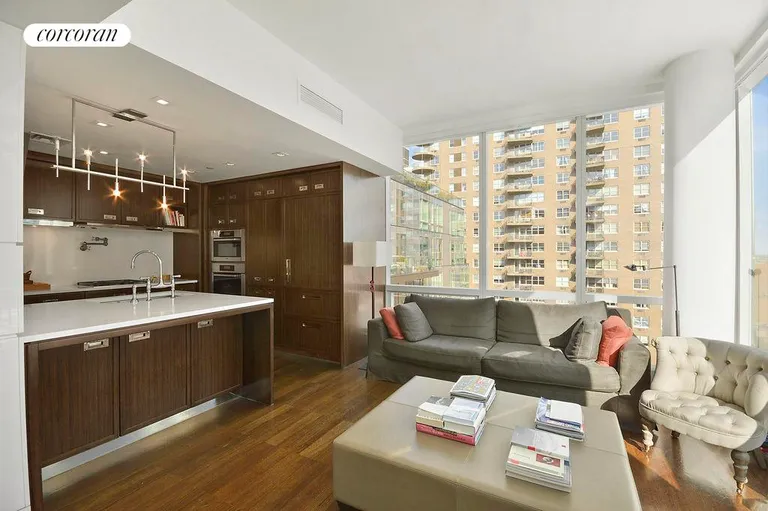 New York City Real Estate | View 151 East 85th Street, PHD | Kitchen and Lounge/Den  | View 4