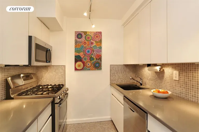 New York City Real Estate | View 225 East 57th Street, 11M | Renovated Kitchen With New Stainless Appliances | View 3