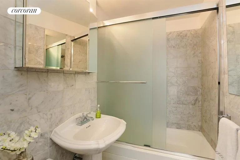 New York City Real Estate | View 225 East 57th Street, 11M | Renovated Bathroom | View 5