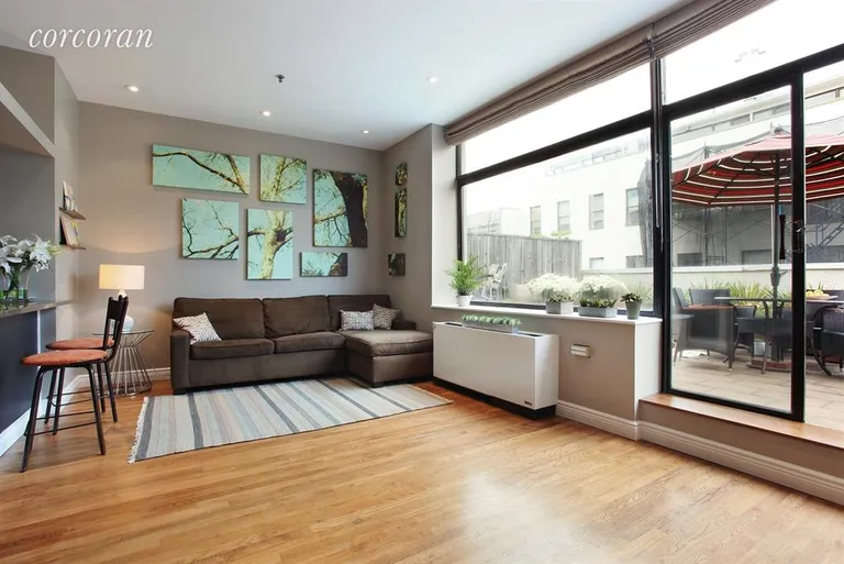 New York City Real Estate | View 121 Pacific Street, P3B | Bright LR opens to private Terrace, opposite WBFP | View 2