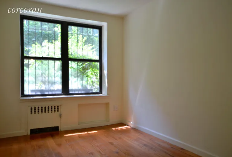 New York City Real Estate | View 222 East 75th Street, LE | Large Bedroom with green view!  | View 3