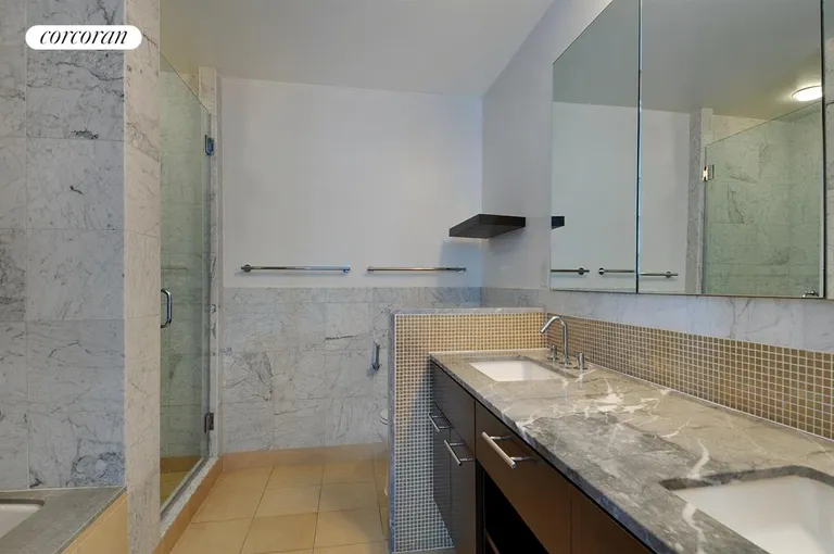 New York City Real Estate | View 261 West 28th Street, 10A | Luxurious 5 fixture en-suite master bathroom | View 6