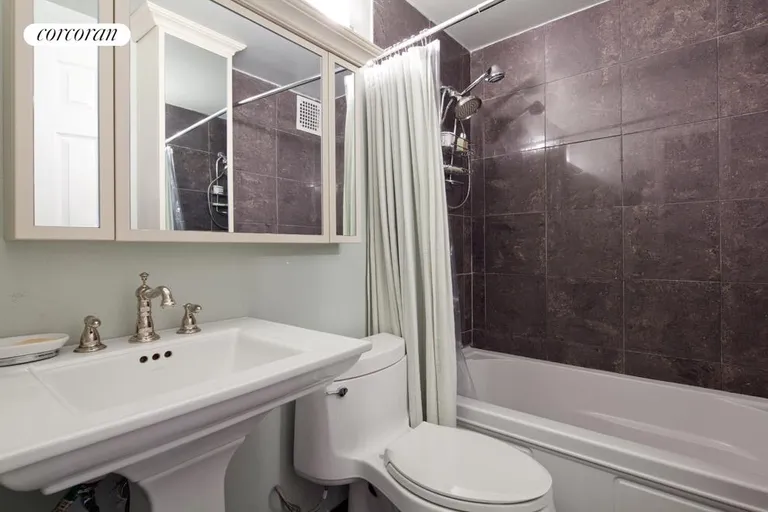 New York City Real Estate | View 186 West 80th Street, 5C | Renovated bathroom with mirrored medicine cabinet | View 4