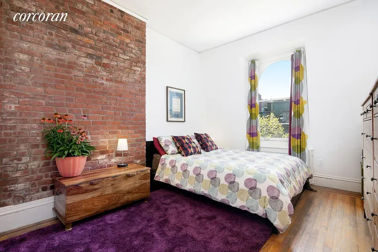 New York City Real Estate | View 289 Henry Street, 4 | Master Bedroom has western light and exposed brick | View 2