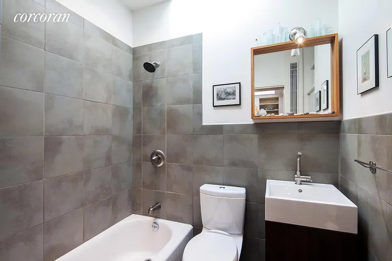 New York City Real Estate | View 289 Henry Street, 4 | Renovated bathroom with skylight above. | View 7