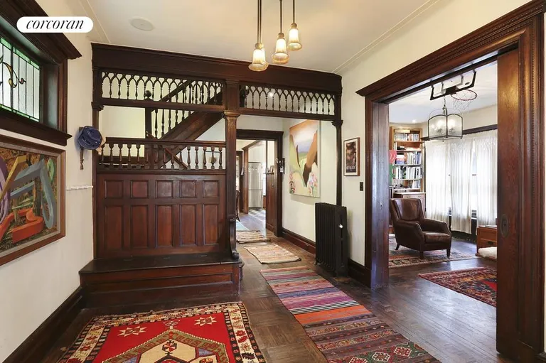 New York City Real Estate | View 1211 Ditmas Avenue | Entry foyer with storage bench and pocket door | View 2