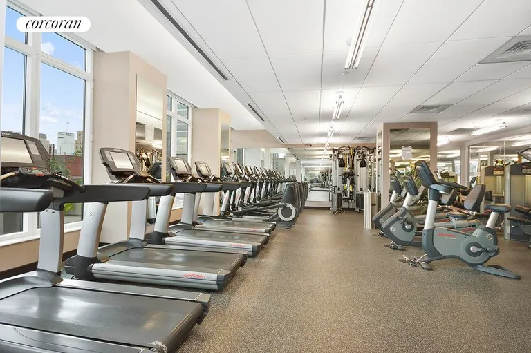 New York City Real Estate | View 247 West 46th Street, 1205 | Gym with views | View 4