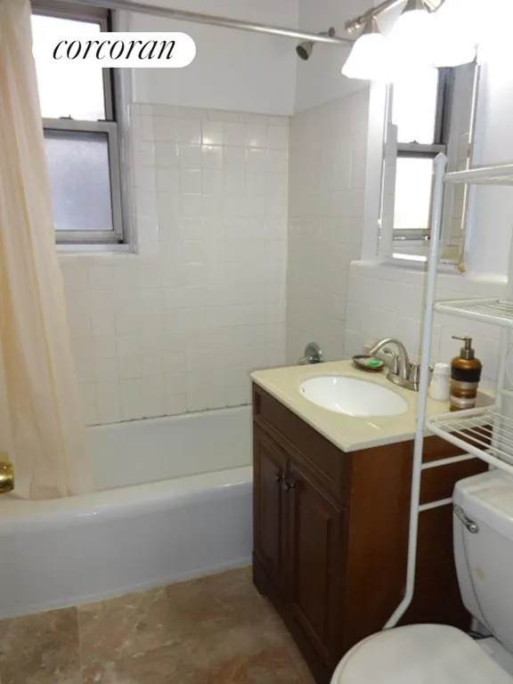 New York City Real Estate | View 2102 Holland Avenue, 3F | Tiled Bathroom | View 6