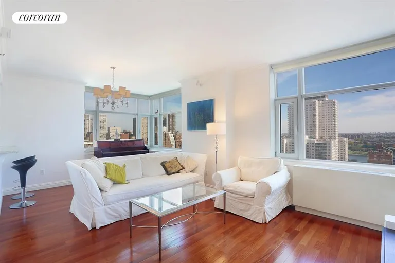 New York City Real Estate | View 404 East 76th Street, 20A | Living Room with views east, to the river | View 4