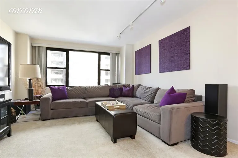 New York City Real Estate | View 305 East 40th Street, 15F | Living Room faces West | View 2