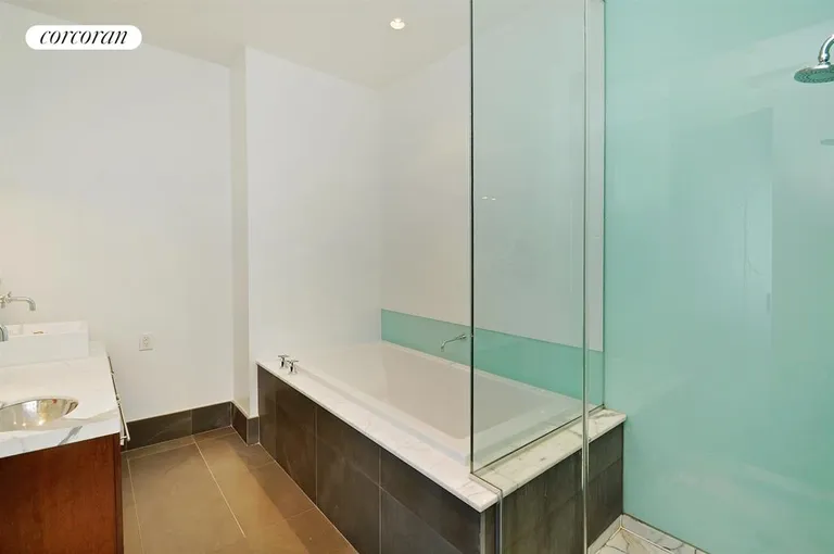 New York City Real Estate | View 60 Broadway, 5N | Master bathroom with shower stall and soaking tub | View 4