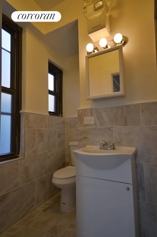 New York City Real Estate | View 206 Thompson Street, 15 | Gut renovated bath with stone finish. | View 5