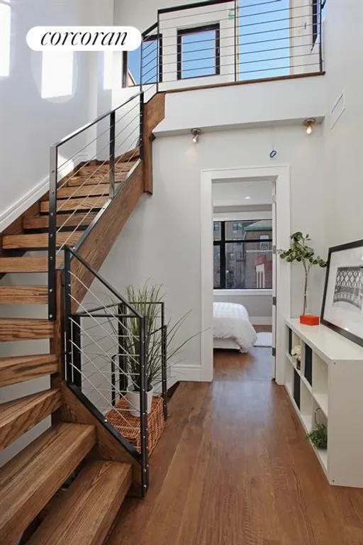 New York City Real Estate | View 259 Hoyt Street | Double Height Foyer with Panoramic Windows | View 6