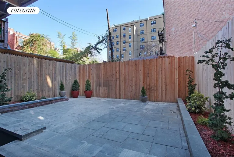 New York City Real Estate | View 259 Hoyt Street | Bluestone Pavers and Planting Beds in Back Yard | View 9