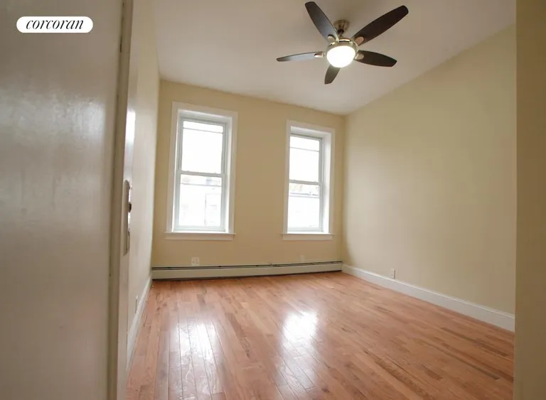 New York City Real Estate | View Sterling Street, #2 | Bedroom w/ remote-controlled ceiling fan | View 7
