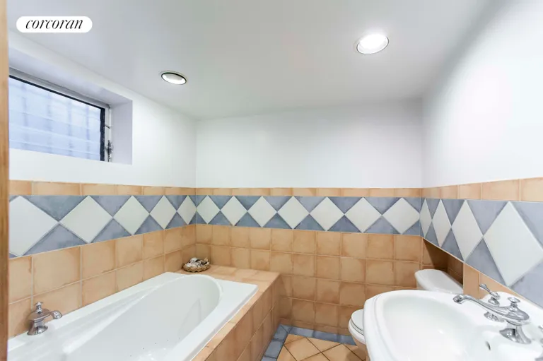New York City Real Estate | View 75-39 Kessel Street | Basement bathroom with whirlpool tub for 2 | View 11