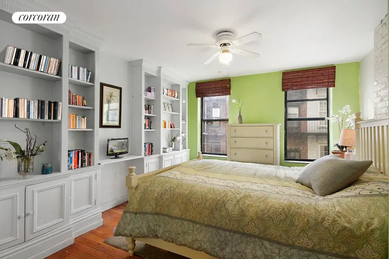 New York City Real Estate | View 244 East 90th Street, 3C | Bright Bedroom with Customized Shelving | View 3