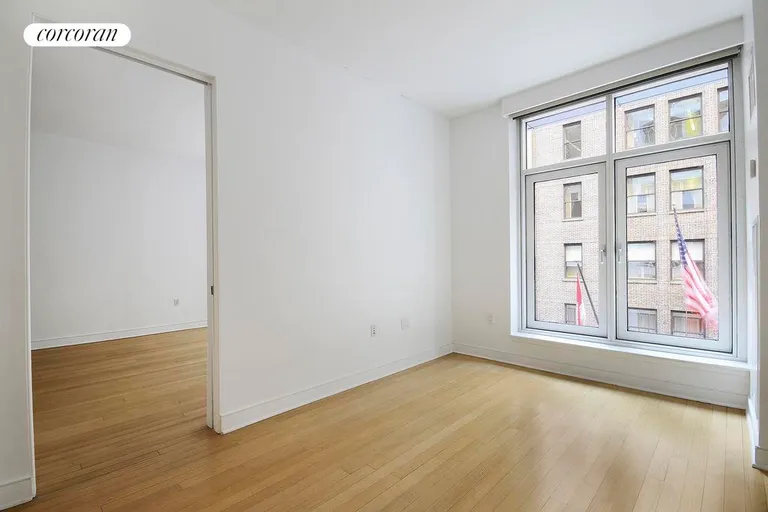 New York City Real Estate | View 5 East 44th Street, 5A | bedroom with pocket doors | View 5