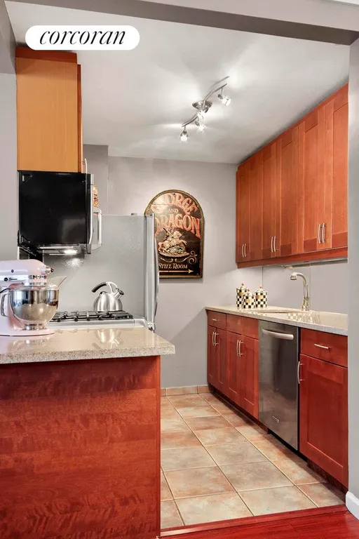 New York City Real Estate | View 345 East 56th Street, 16D | Renovated kitchen with stainless steel appliances | View 2