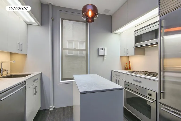 New York City Real Estate | View 340 West 19th Street, 22 | Contemporary Kitchen with Center Island | View 7