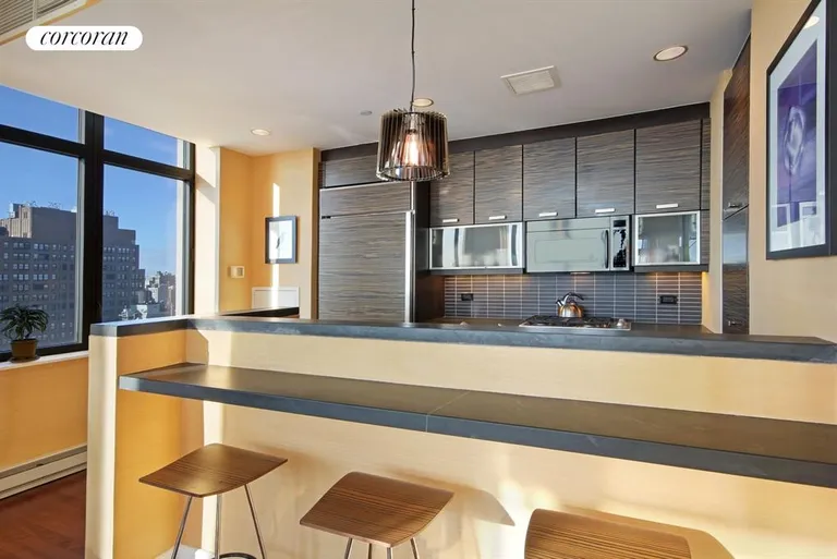 New York City Real Estate | View 101 West 24th Street, 26B | New Windowed Kitchen with Breakfast Bar | View 9