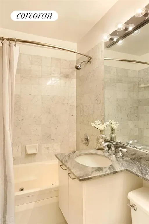 New York City Real Estate | View 225 East 57th Street, 3C | Lovely Marble Bathroom | View 2