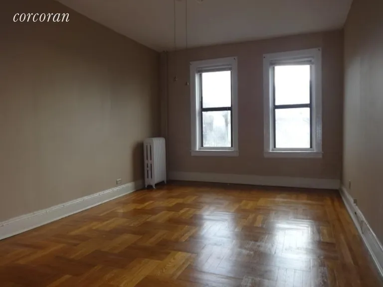 New York City Real Estate | View 1506 Overing Street, 7B | Living room with 2 front windows | View 2