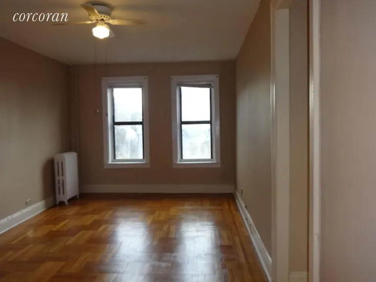 New York City Real Estate | View 1506 Overing Street, 7B | Living room with lots of natural light | View 3