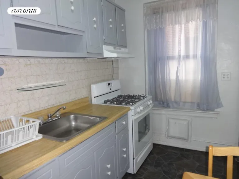 New York City Real Estate | View 1506 Overing Street, 7B | Kitchen with window | View 7