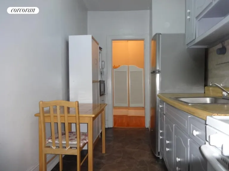 New York City Real Estate | View 1506 Overing Street, 7B | Kitchen with eat in space | View 9