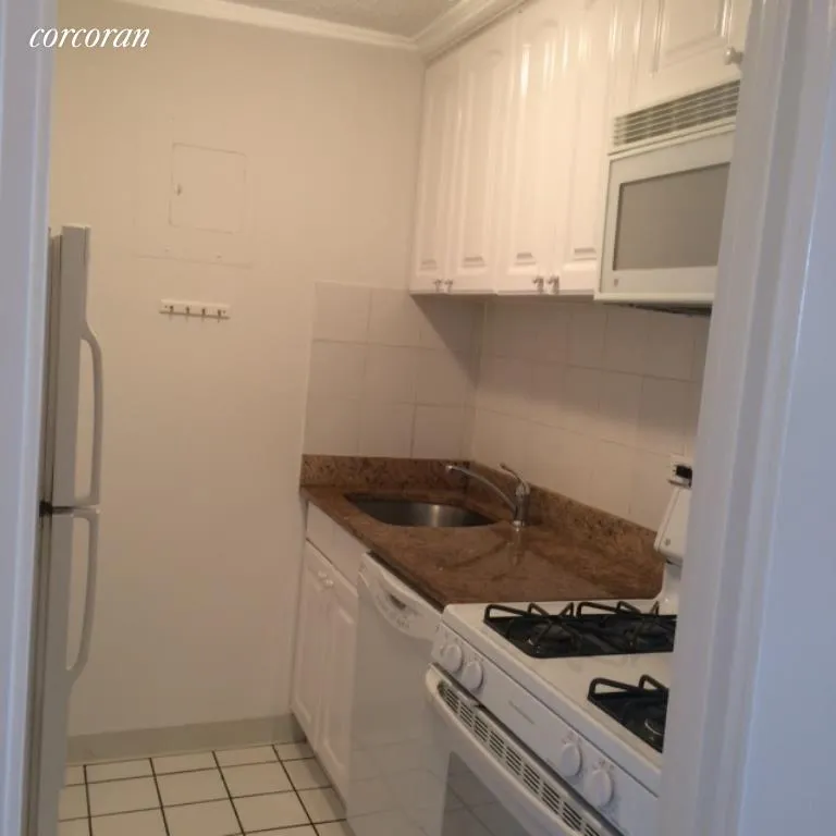 New York City Real Estate | View 301 East 79th Street, 17E | Renovated Kitchen with Granite counters | View 3