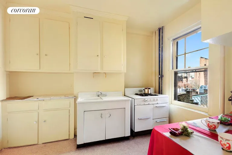 New York City Real Estate | View 15 West 11th Street, 6A | Large eat-in-kitchen with window & city view. | View 3