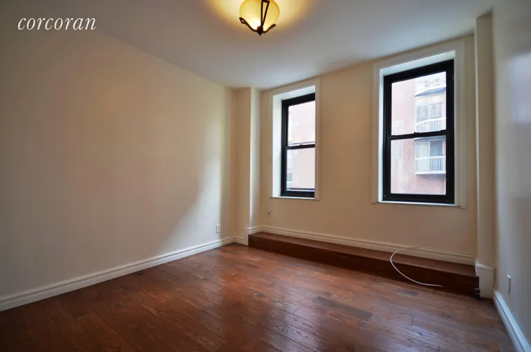New York City Real Estate | View 202 Thompson Street, 4 | Ample living area, south facing.  | View 2