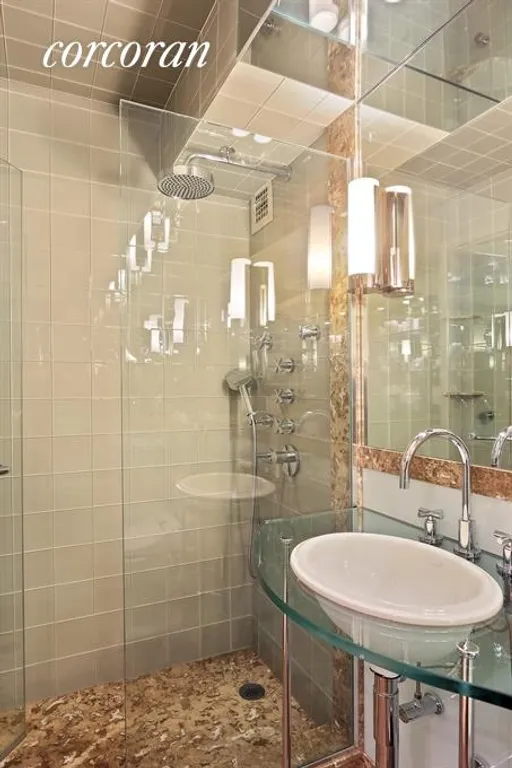 New York City Real Estate | View 345 East 69th Street, 4A | Bathroom, with marble & glass tile spa shower | View 3
