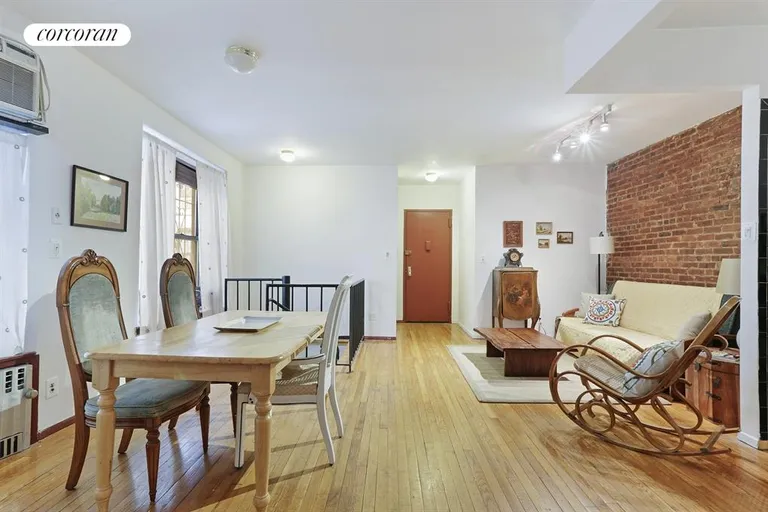 New York City Real Estate | View 403 Avenue C, 1A | Dining room & more exposed brick | View 2