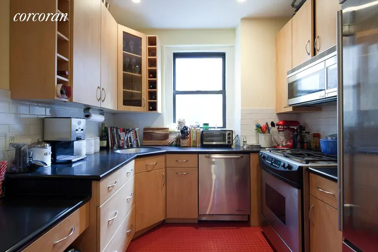 New York City Real Estate | View 135 West 16th Street, 50 | Windowed kitchen with stainless steel appliances | View 2