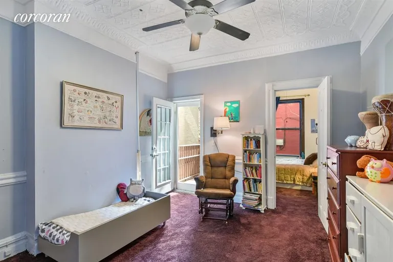 New York City Real Estate | View 1213 8th Avenue, 1L | Larger bedroom with door to the yard | View 4