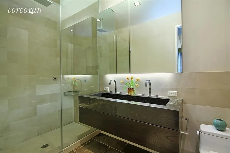 New York City Real Estate | View 140 West 22Nd Street, 7B | Limestone Master Bathroom with double stall shower | View 6