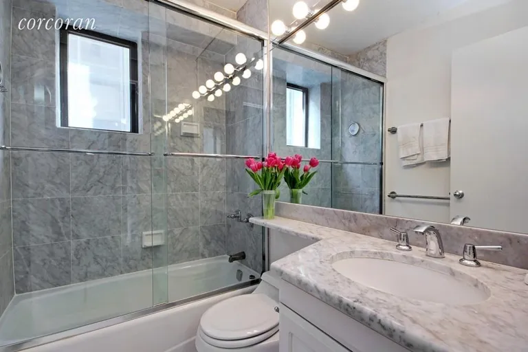 New York City Real Estate | View 45 East 25th Street, 25A | Windowed bath in white marble | View 5