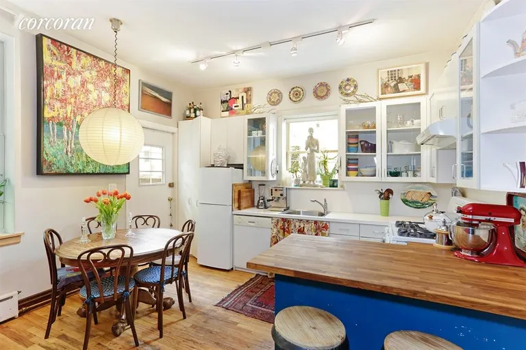 New York City Real Estate | View 110 Clinton Avenue, 1C | Kitchen and Dining Area with door to huge garden | View 2