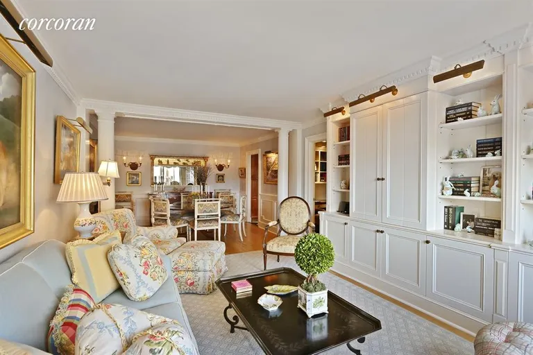 New York City Real Estate | View 115 East 87th Street, 12A | Living Room separating Dining w/columns & moldings | View 3