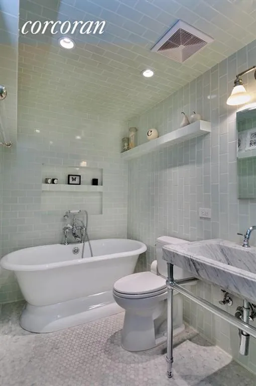 New York City Real Estate | View 214 Avenue A, 1E | Master bathroom w/ tub & shower stall (not shown) | View 6