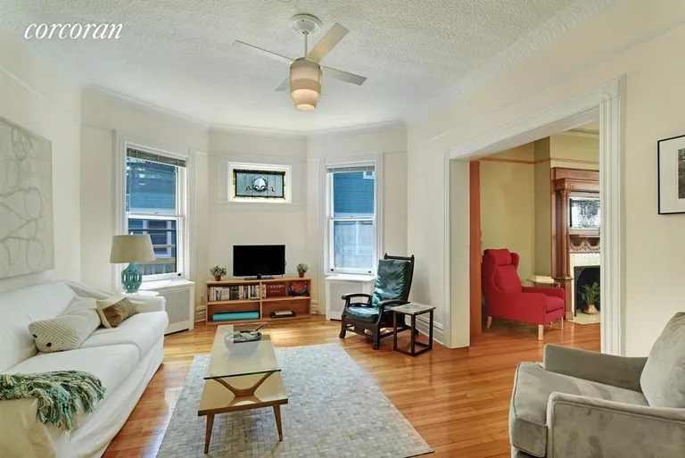 New York City Real Estate | View 329 Westminster Road | South facing back parlor with stained glass | View 4