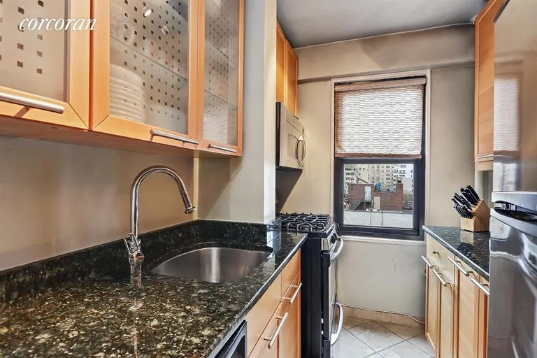 New York City Real Estate | View 240 East 76th Street, 10F | Windowed Kitchen, stainless & granite | View 3