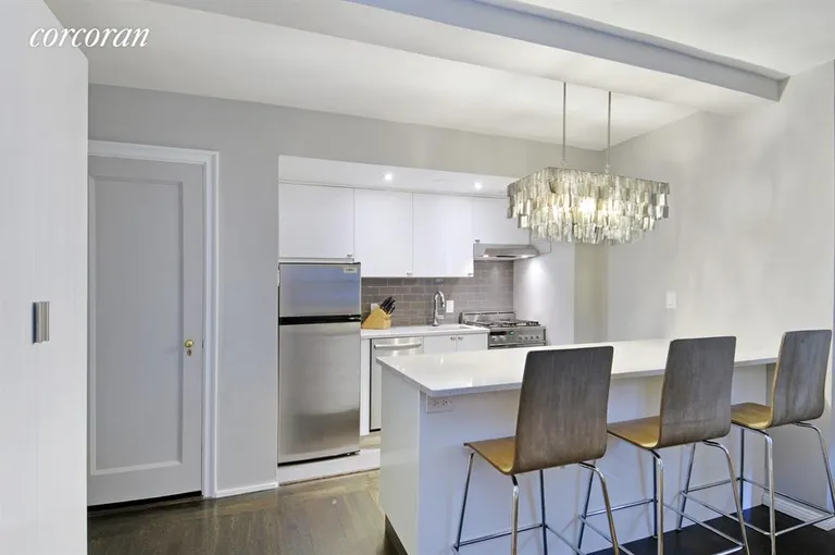 New York City Real Estate | View 225 East 73rd Street, 1A | Renovated kitchen with stainless steel appliances | View 2