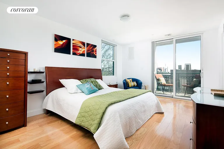 New York City Real Estate | View 52 Dean Street, 4C | Master bedroom with balcony and en suite bathroom | View 4