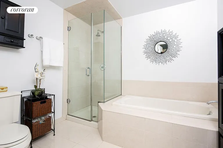 New York City Real Estate | View 52 Dean Street, 4C | Master bathroom with soaking tub and shower stall | View 7