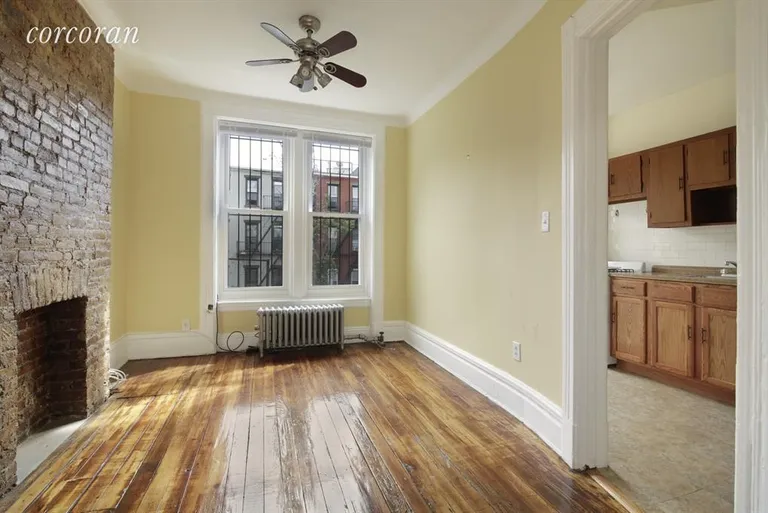 New York City Real Estate | View 12 Berkeley Place, 3 | Living Room and a peak at the kitchen. | View 2