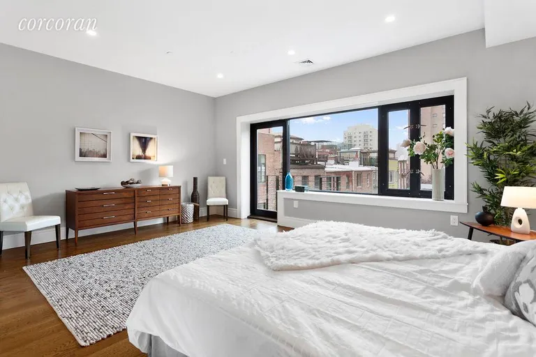 New York City Real Estate | View 411 DeGraw Street | Master bedroom with large picture window & balcony | View 5